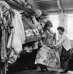 Miss Frances Roe wardrobe supervisor at the Coventry Theatre holds one of 10