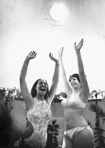 Swimming Costumes Prints: Miss Great Britain (L) and Actress Trix Pelham revel in the artifical sunshine of