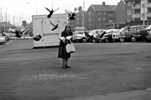 Miss Helen Fleming, of Liverpool, feeds the pigeons near her home