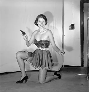 Miss Leap Year: Belinda Penelope seen here proposing to boyfriend holding a gun