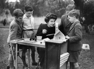 00050 Prints: Miss. Loewy niece of Mr. Somerfield showing the children how to paint the cast pieces