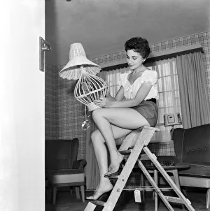 Miss Madeleine Mono was film starlet, now to be married, decorates flat