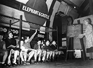 Underground Prints: Miss A Potter teaches children in a maths lesson in the Elephant & Castle Underground