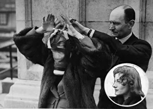 Gas Masks Prints: Miss Sarah Churchill, the Prime Ministers daughter with Wing Commander Hodsoll