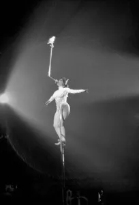 Miss Wendy performs her balancing act with a pigeon perched on the end of a sword during