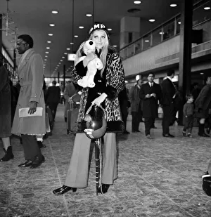 Miss World, Eva Rueber-Staier wearing the U. S. helmet pictured at Heathrow