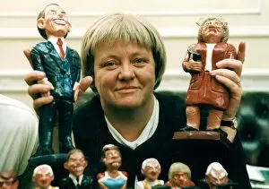 Images Dated 23rd December 1997: Mo Mowlam MP holding figurine of herself December 1997 and Prime Minister Tony Blair