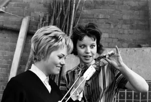 Eating Out Prints: Model, actress and pop singer Wendy Richard seen here serving a chicken leg to Diana