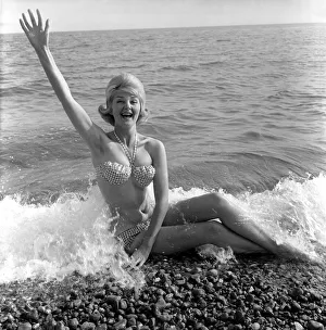 Model Angela Williamson on the beach. June 1960 M4326-001