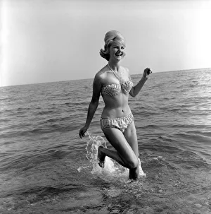 Model Angela Williamson on the beach. June 1960 M4326-003