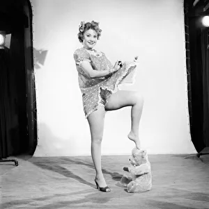Model Audrey Nicholson wearing nightee seen here with her Teddy bear. 1959