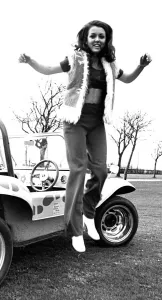 00109 Prints: A model in a beach buggy wearing trousers and a fur gillet in April 1970