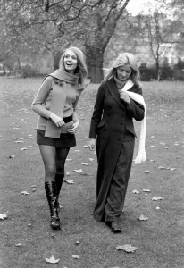 Mini Prints: Model Blanche Webb wearing mini skirt and knee high boots with model Monica Hahn wearing