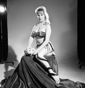 Model Carol Gardener as Eve about to take a bite from the apple. 1960 E421-011
