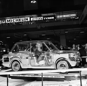 See Through Prints: Model Caron gardner sits inside a Hillman Imp built of perspex to show the interior works