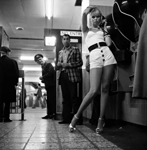 Model Christine Donna seen here using the public telephones at Holborn tube station