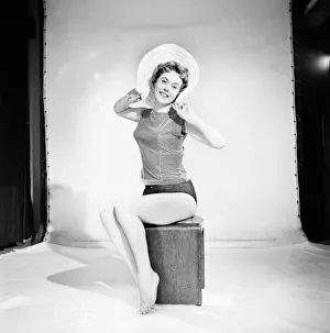 Model Darien Leigh seen here modelling the latest hat fashions. 1965