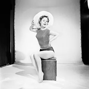 00061 Prints: Model Darien Leigh seen here modelling the latest hat fashions. 1965