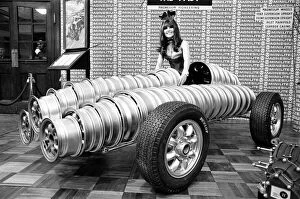 Images Dated 19th October 2010: Model drapped over car made from wheels at Motor Show at Horticultural Hall 2nd January