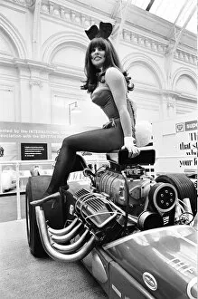 Images Dated 19th October 2010: Model drapped over a hot rod dragster car at Motor Show at Horticultural Hall 2nd January