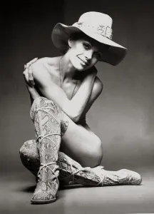 Boots And Shoes Prints: Model Emma Vincent poses wearing python printed suede boots by Gaby