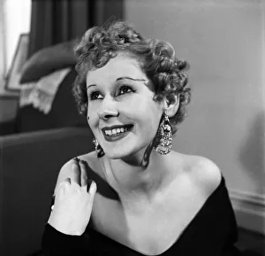 Model Gaby in a black jersey material dress with low cut neckline. March 1953 D1226