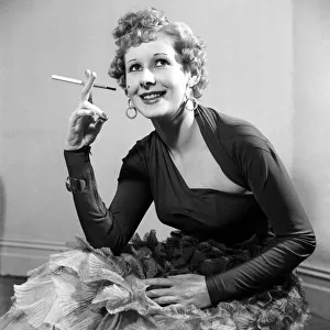 Model Gaby in a black jersey material dress with low cut neckline. March 1953 D1226-001