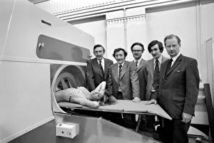 Model Gillian Duxbury in the E. M. I. X-Ray scanner with the team from L / R Godfrey