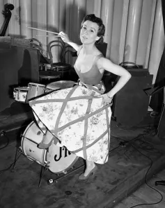 Model, Guislaine, pictured wearing a bold swoop neckline dress designed by Italian