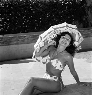 00013 Prints: Model Jacqueline seen here demonstrated the latest in sun shades. July 1952 C3386