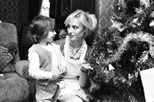 Christmas Tree Prints: Model Janet Slaven seen here helping to dress a Christmas tree December 1982