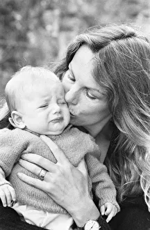 Former model Jean Shrimpton, 36, pictured with baby son Thaddeus, aged 3 months