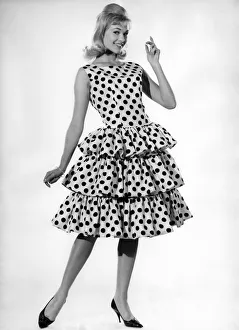 00060 Prints: Model Jo Waring wearing a polka dot patterned dress with frills