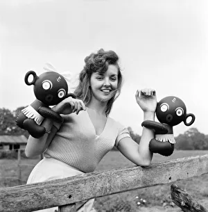 Model Kim Pearson seen here with inflatable alien toys. 1962 E422-007