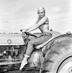 Model Maja Hafernik seen here working on the farm. 1965 E504-007