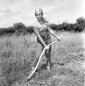 Model Maja Hafernik seen here working on the farm. 1965 E504-004