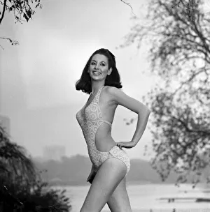 Model Marion Proffitt wearing a Turquoise Lycra one-piece swimsuit cut low at the sides
