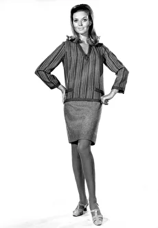 00067 Prints: Model Maureen Walker wearing a striped long sleeved top and skirt. November 1968