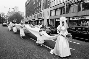 Model Michelle Hardy and a squad of bridesmaids show off her wedding dress