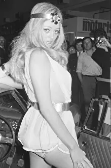 Model posing beside a car at the 1971 Earls Court motor show 19th October 1971