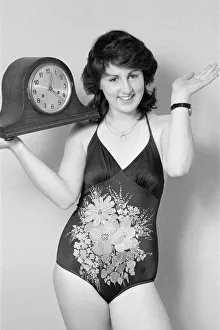 Swimsuit Prints: Model reminding people to put their clocks forward by one hour at the start of British