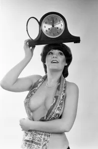 00459 Prints: Model reminding people to put their clocks back by one hour at the end of British Summer