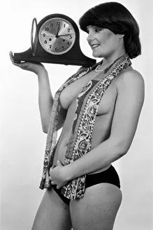 00459 Prints: Model reminding people to put their clocks back by one hour at the end of British Summer