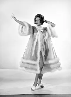 Night Dress Prints: Model Rita Royce wearing marabou fur trimmed nightie. December 1963