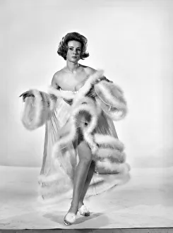 Model Rita Royce wearing marabou fur trimmed nightie. December 1963