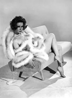 Night Dress Prints: Model Rita Royce wearing marabou fur trimmed nightie. December 1963