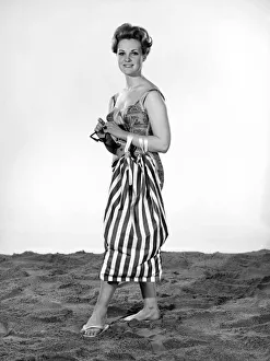 Model Roma Reeves wearing beach toga that doubles as a beach towel. May 1962