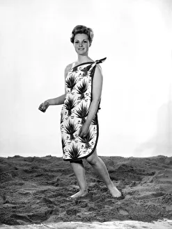 Model Roma Reeves wearing beach toga that doubles as a beach towel. May 1962