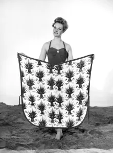 Model Roma Reeves wearing beach toga that doubles as a beach towel. May 1962