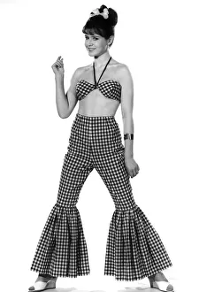00038 Prints: Model Rosemary Bell wearing checkered trousers with flared bottoms